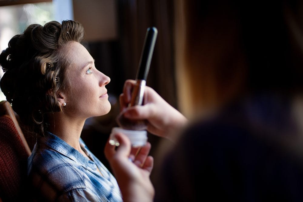 Beautiful Window Light falling on Bride during makeup during Kayla and Jackson's Rustic Mammoth Lake Wedding, Photo taken by Amy Huang Photography