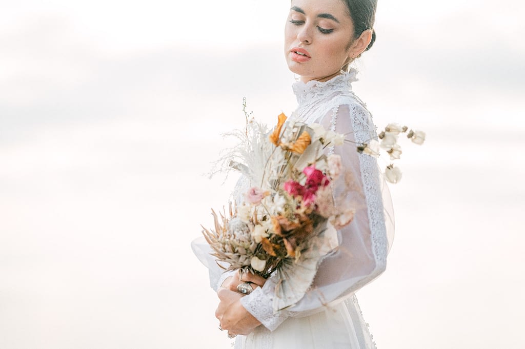 beautiful bride in a antique dress and a dry bouquet by Amy Huang Photography, a San Diego Photographer
