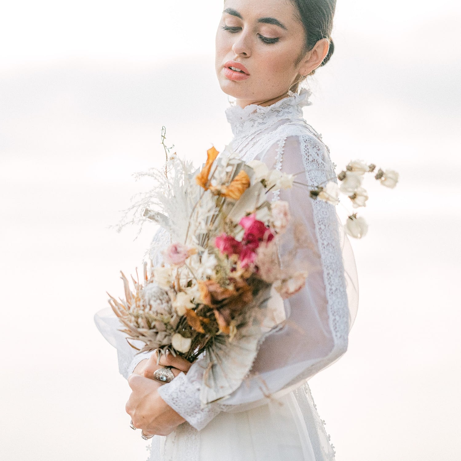 beautiful bride in a antique dress and a dry bouquet by Amy Huang Photography, a San Diego Photographer